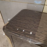 Dark Glossy Nightstand with Woven Leather Side Panels and Hidden Drawer Pulls